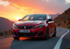 Peugeot 308 GTI au lever du soleil en montagne